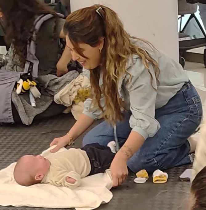 Noya with baby laying down